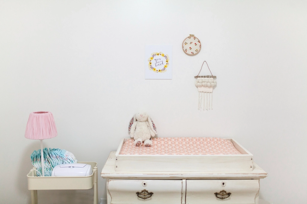 A calm, styled nursery with soft lighting
